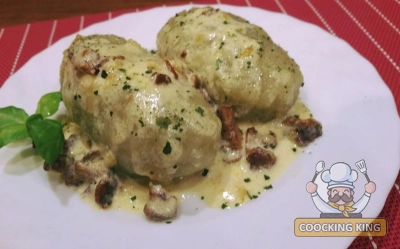 Lithuanian cepelinai: Potato dumplings with mushroom sauce & bacon